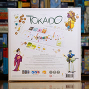 Vista trasera del juego de mesa 'Tokaido' con detalles y componentes, en Mana House - Viaje. Viaje.