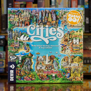 Portada del juego 'Cities' disponible en Mana House – Juego de construcción de ciudades, Selección de acciones, Diseño urbano, Ilustrado por Jorge Tabanera, Partidas de 40 minutos.