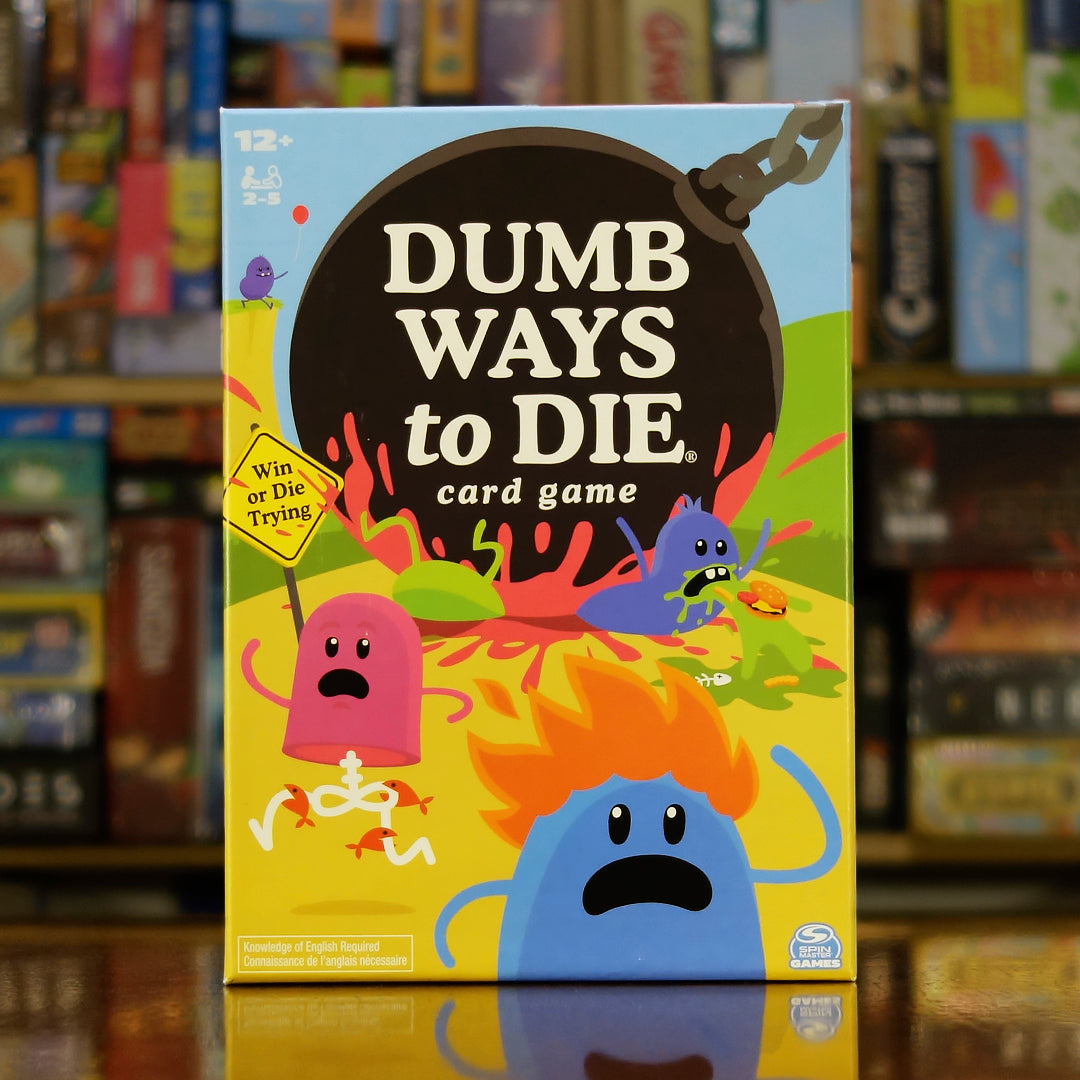 Portada del juego de mesa 'Dumb Ways to Die' disponible en Mana House - Humor, Habilidad, Rápido, Familia, Fiesta.