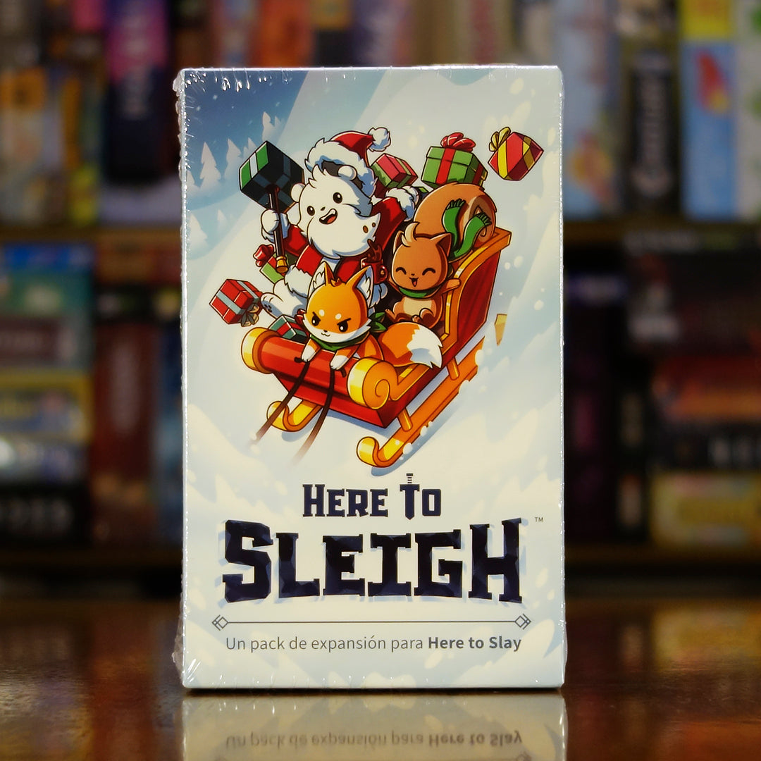 Portada de la expansión 'Here to Slay: Here to Sleigh' disponible en Mana House - Expansión, Festivo, Cartas, Estrategia, Navidad.