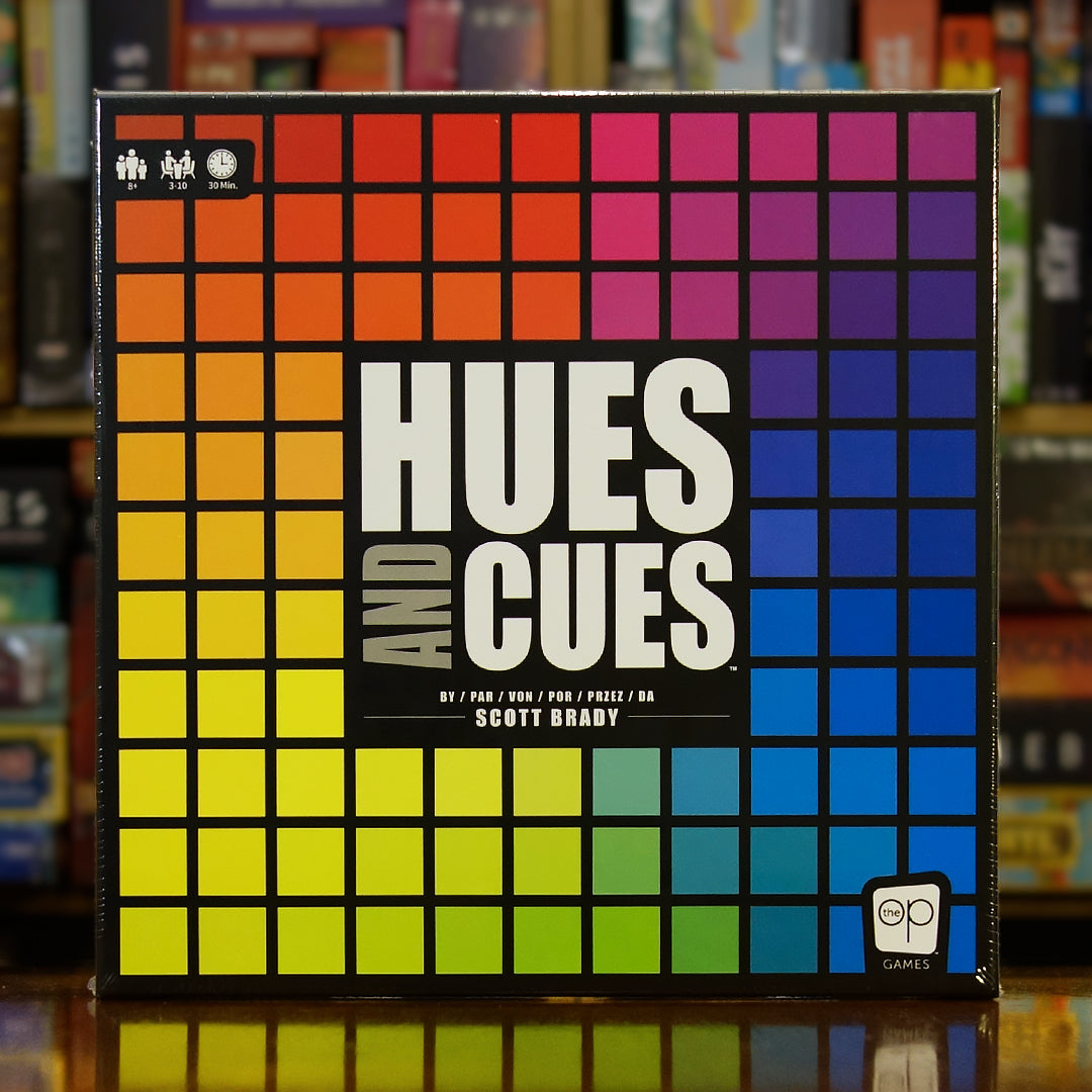 Portada del juego Hues and Cues disponible en Mana House – Juego de comunicación, Asociación de palabras y colores, Tablero con 480 tonos, Party game para grupos, Estilo vibrante y colorido.