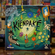 Portada del juego de mesa 'Kiénpaké' disponible en Mana House - Humor. Cartas, Humor.