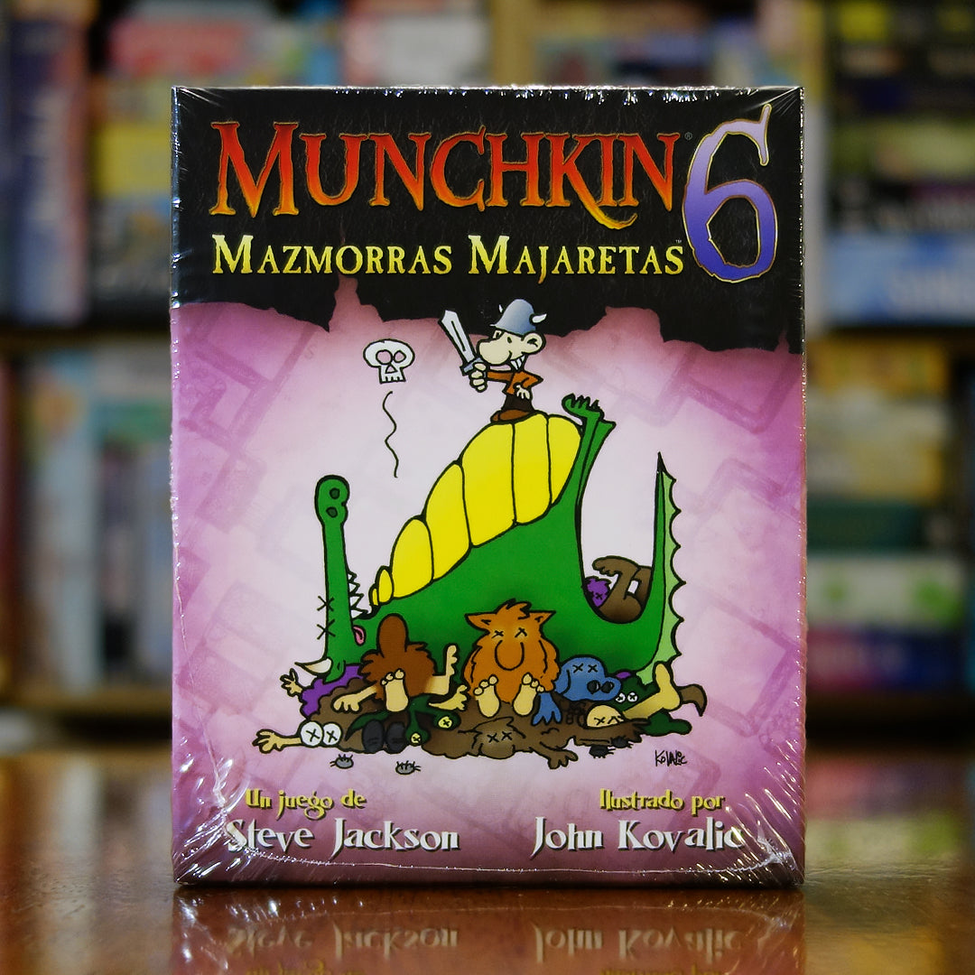 Portada del juego Munchkin 6: Mazmorras Majaretas disponible en Mana House – Expansión para Munchkin, Mazmorras con reglas únicas, Portales entre mazmorras, Humor satírico, Ilustraciones de John Kovalic. Munchkin 6: Demented Dungeons