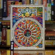 Portada del juego 'Sagrada' disponible en Mana House – Juego abstracto, Vitrales inspirados en la Sagrada Familia, Dados coloridos, Estrategia visual, Arte y lógica combinados.