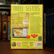 Trasera del juego Three Sisters disponible en Mana House – Cultivo de maíz frijoles y calabazas, Gestión de huerto y colmenar, Pistas interconectadas, Herramientas con habilidades especiales, Modo solitario incluido.