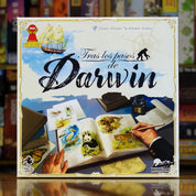 Portada del juego de mesa 'Tras los Pasos de Darwin' disponible en Mana House - Familiar, Exploración, Naturaleza, Estrategia, Educación.